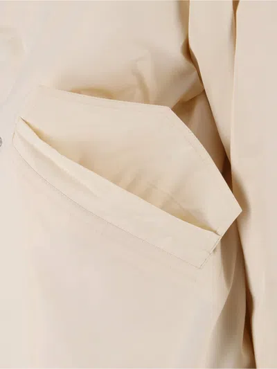 Jil Sander Hooded Longline Jacket With Faux Fur Trim In Neutral