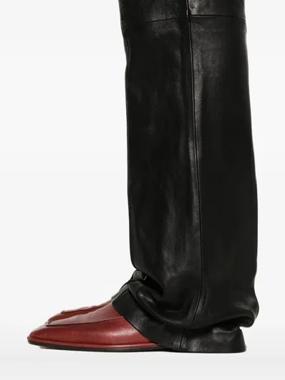 Amiri Leather Bootcut Trousers In Black