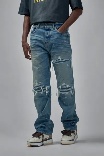 Amiri Men Blue Jeans With Ripped Details On The Front And Logo Patch On The Rear In Denim Man In Blue