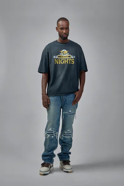 Amiri Men Blue Jeans With Ripped Details On The Front And Logo Patch On The Rear In Denim Man In Blue