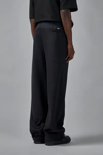 Amiri Logo Print Track Pants In Black