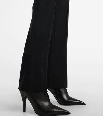 Alexander Mcqueen Tailored Wool Trousers Featuring Flared Hem In Black