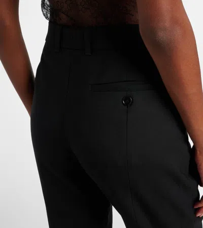 Alexander Mcqueen Tailored Wool Trousers Featuring Flared Hem In Black