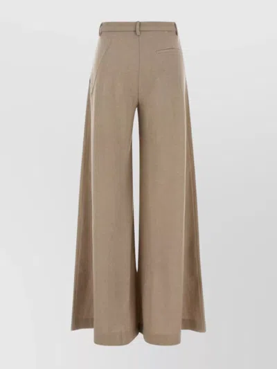 The Andamane Wide-leg Wool Trousers Featuring Pleats In Brown