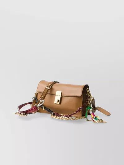 Prada Soft Sound Small Leather Shoulder Bag With Charms In Brown
