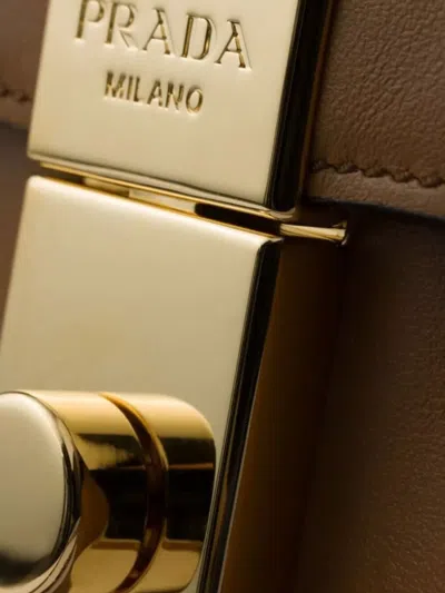 Prada Soft Sound Small Leather Shoulder Bag With Charms In Brown