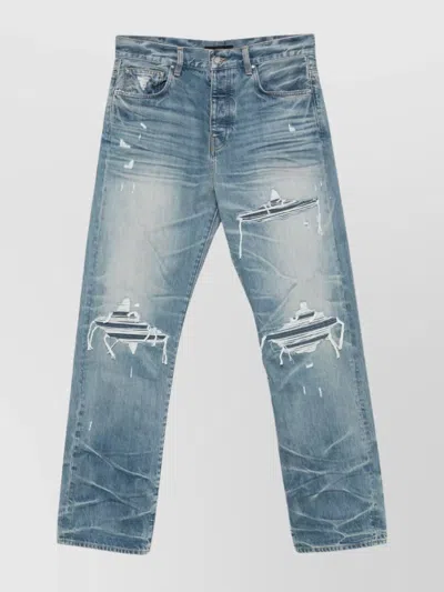 Amiri Men Blue Jeans With Ripped Details On The Front And Logo Patch On The Rear In Denim Man In Blue