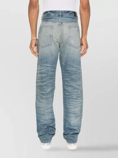 Amiri Men Blue Jeans With Ripped Details On The Front And Logo Patch On The Rear In Denim Man In Blue