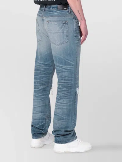 Amiri Men Blue Jeans With Ripped Details On The Front And Logo Patch On The Rear In Denim Man In Blue