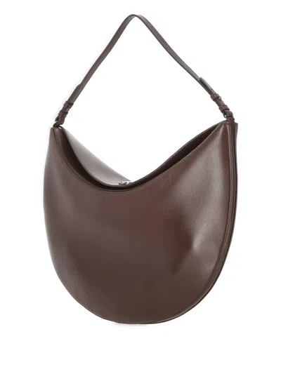 Jacquemus Le Calisso Rond Large Brown Shoulder Bag With Adjustable Strap And Embossed Logo In Leathe In Brown