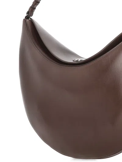 Jacquemus Le Calisso Rond Large Brown Shoulder Bag With Adjustable Strap And Embossed Logo In Leathe In Brown