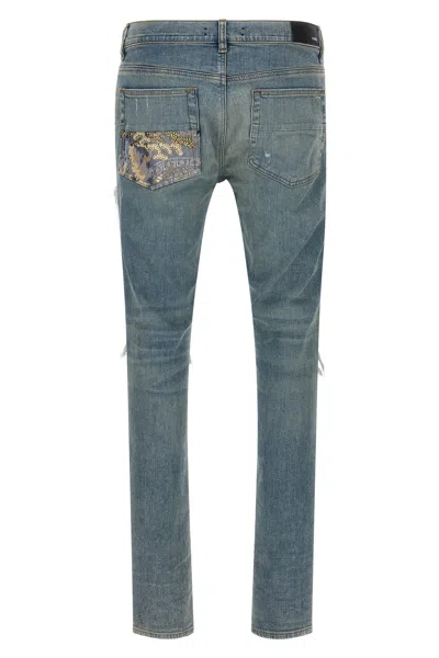 Amiri Distressed Five-pocket Denim Trousers In Blue