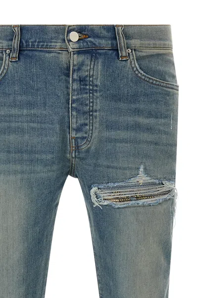 Amiri Distressed Five-pocket Denim Trousers In Blue