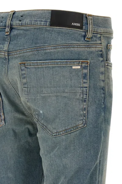 Amiri Distressed Five-pocket Denim Trousers In Blue