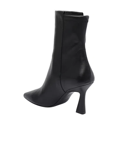 Stuart Weitzman Pointed Toe Ankle Boots With Sculpted Mid-height Heel In Black