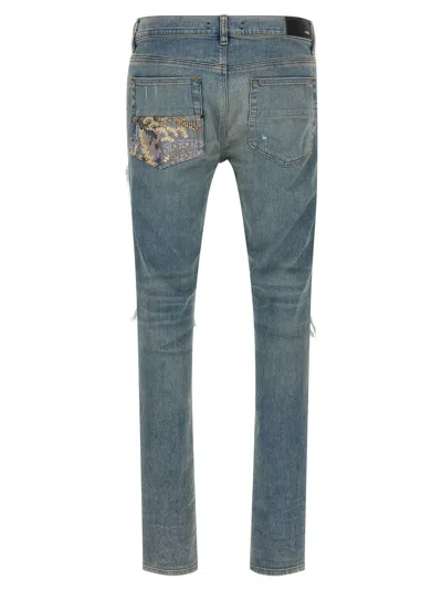 Amiri Distressed Five-pocket Denim Trousers In Blue
