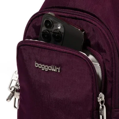 Baggallini The Travel Smart Edit Securtex Anti Theft Daytripper Sling Bag In Purple