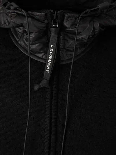 C.p. Company Men Black Jacket With Drawstring Hood And Logo Plaque On The Sleeve In Wool Man In Black