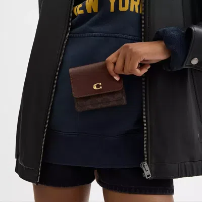 Coach Mila Small Flap Wallet In Signature Canvas In Brown