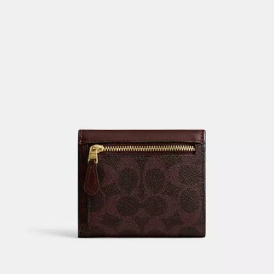 Coach Mila Small Flap Wallet In Signature Canvas In Brown