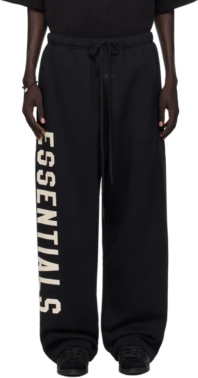 Essentials Mens Jet Black Brand-print Wide-leg Cotton-blend Jogging Bottoms In Black