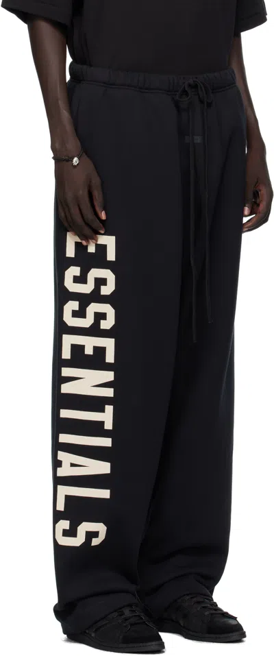Essentials Mens Jet Black Brand-print Wide-leg Cotton-blend Jogging Bottoms In Black