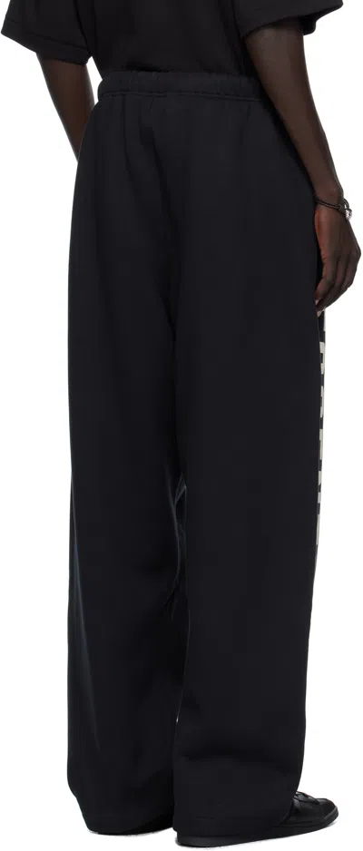 Essentials Mens Jet Black Brand-print Wide-leg Cotton-blend Jogging Bottoms In Black
