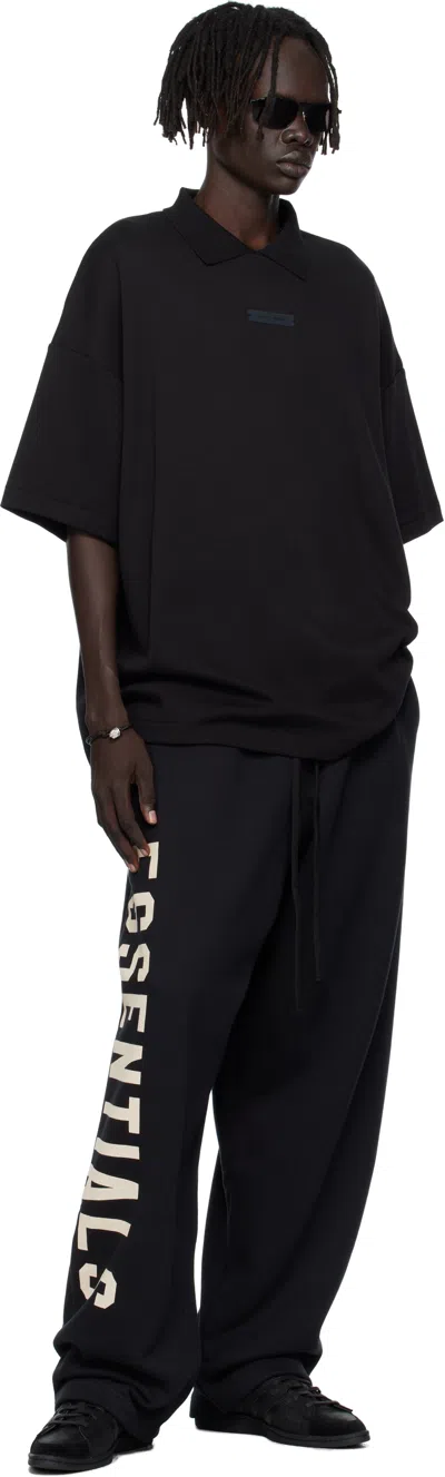Essentials Mens Jet Black Brand-print Wide-leg Cotton-blend Jogging Bottoms In Black