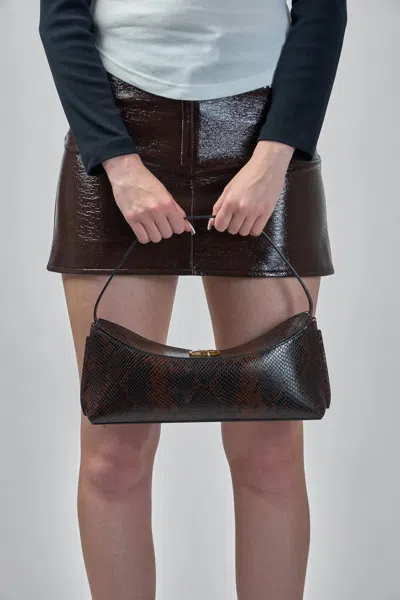 Jacquemus Ovalo Clutch In Brown