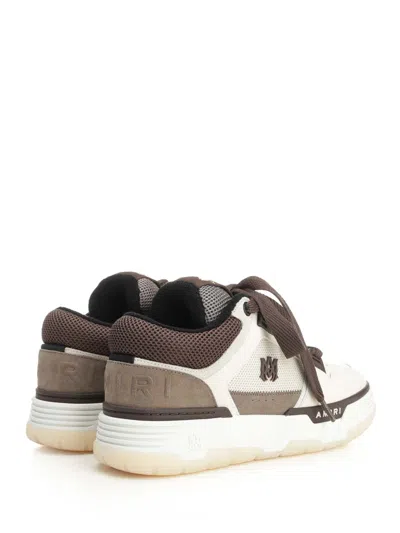 Amiri Brown Low Top Sneakers With Logo Detail On The Side And Mesh Panels In Brown