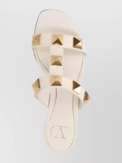 Valentino Garavani Roman Stud Flat Sandals With Signature Pyramid Studs In White