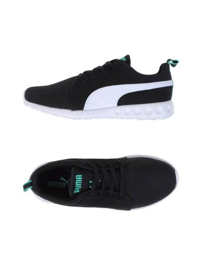 Shop Puma Sneakers In Black