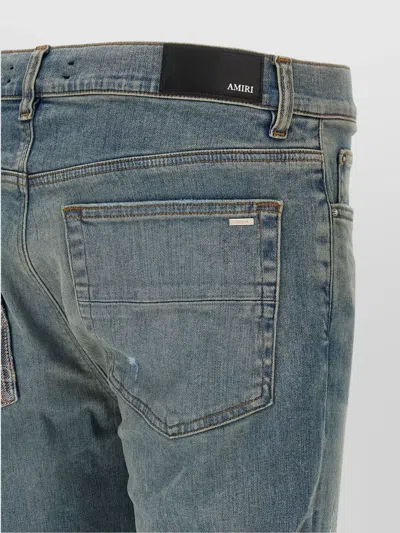 Amiri Distressed Five-pocket Denim Trousers In Blue