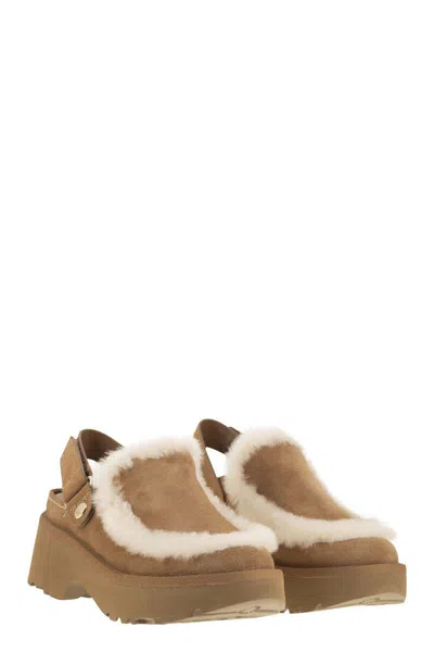 Ugg Suede Mules With Plush Trim And Adjustable Strap In Brown