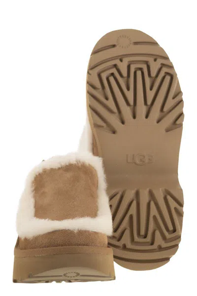 Ugg Suede Mules With Plush Trim And Adjustable Strap In Brown