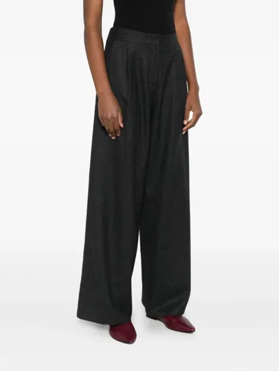 Dušan Elasticated Wool Trousers In Black
