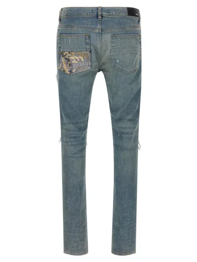 Amiri Distressed Five-pocket Denim Trousers In Blue