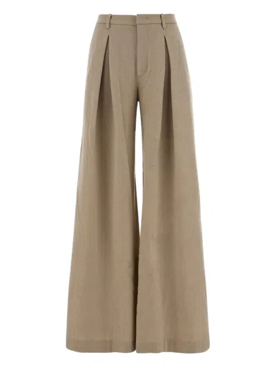 The Andamane Wide-leg Wool Trousers Featuring Pleats In Brown
