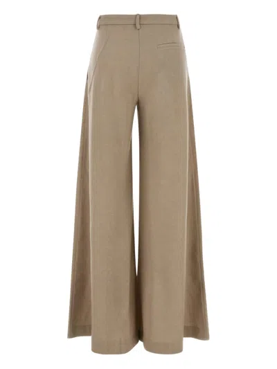 The Andamane Wide-leg Wool Trousers Featuring Pleats In Brown