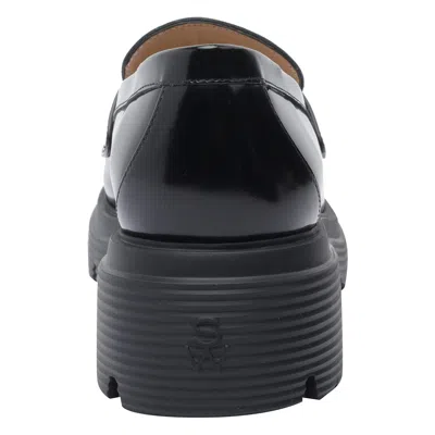 Stuart Weitzman Round Toe Chunky Sole Glossy Loafers In Black