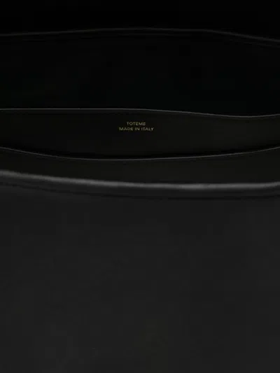 Totême T-lock Foldover Top Shoulder Bag In Black