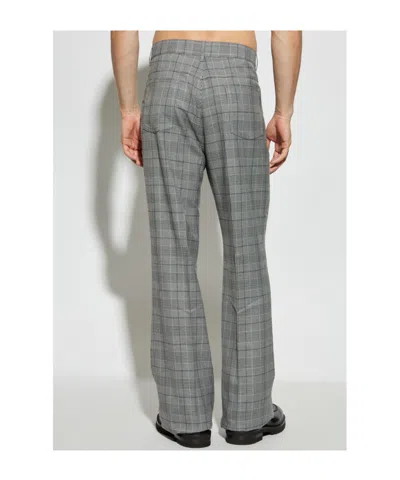 Amiri Checked Flared Trousers In Gray