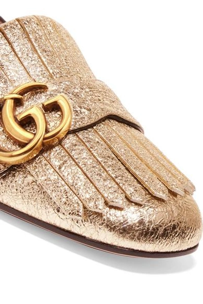 Shop Gucci Marmont Fringed Logo-embellished Metallic Cracked-leather Loafers In Gold