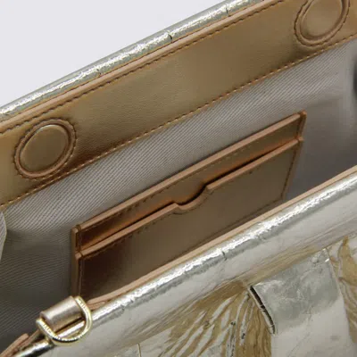 Themoirè Metallic Clutch Bag Shoulder Strap In Gold