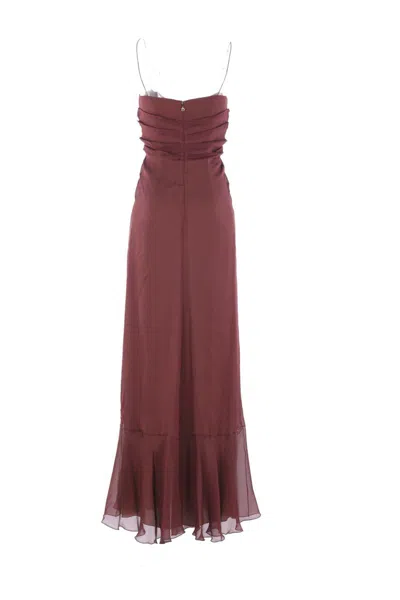 Raquel Diniz Dresses In Red