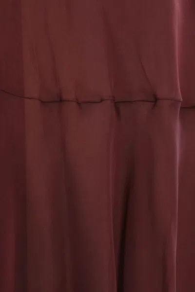 Raquel Diniz Dresses In Red