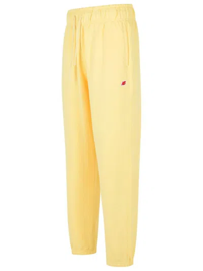 New Balance Elastic-waistband Logo-patch Track Pants In Yellow