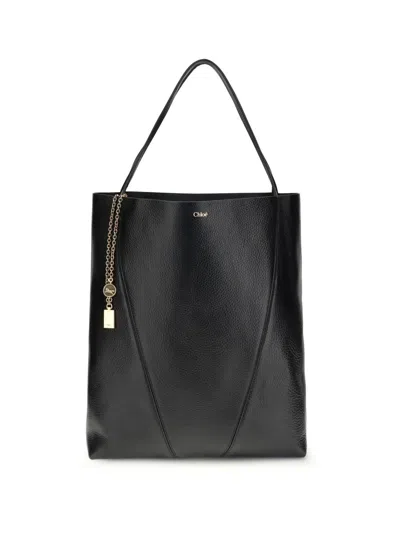 Chloé Large Leather Shopping Bag With Metal Charm In Black