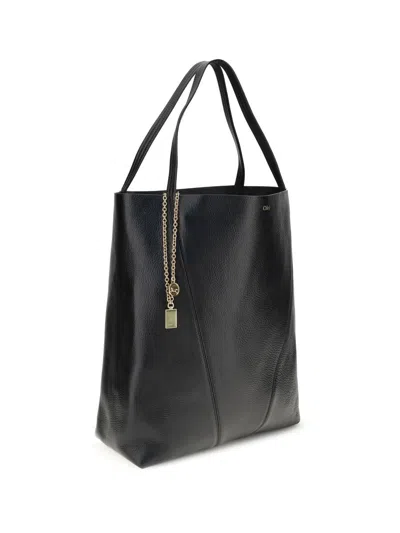 Chloé Large Leather Shopping Bag With Metal Charm In Black