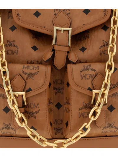 Mcm Monogram Buckle Backpack In Brown